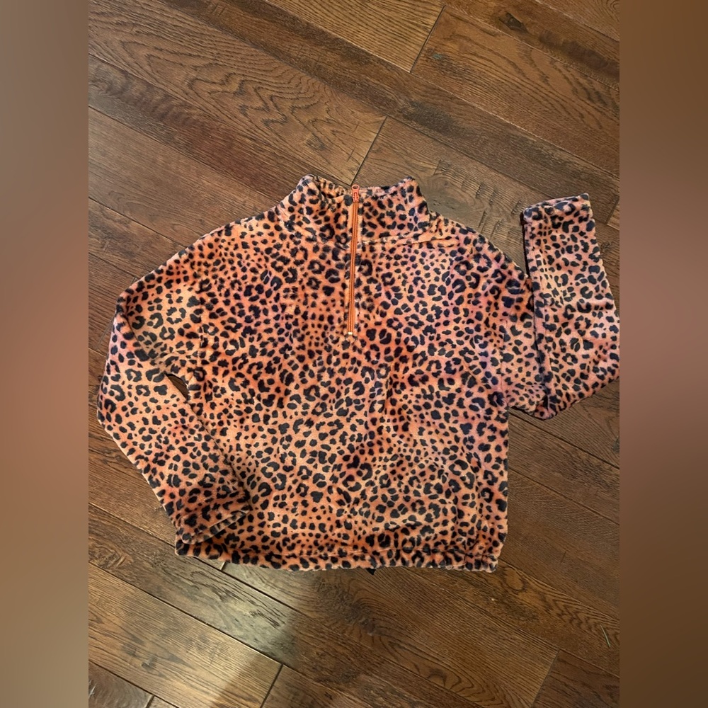 Cold Crush Size Small half zip. Orange and black.